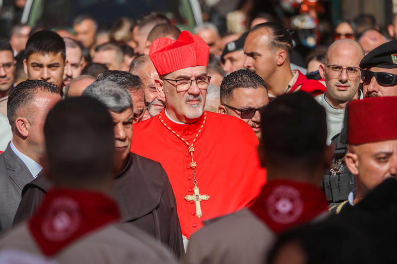 Latin Patriarch of Jerusalem Pierbattista Pizzaballa arrives to the annual Christmas eve procession in the Church of the Nativity, in the West Bank town of Bethlehem, December 24, 2024.
