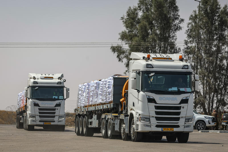 Trucks with loaded with humanitarian aid seen before entering the Gaza Strip, on the Israeli side of the border with the Gaza Strip, May 19, 2025.