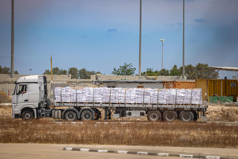 Trucks loaded with humanitarian aid seen before entering the Gaza Strip, on the Israeli side of the border with the Gaza Strip, May 20, 2025.