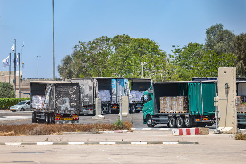 Trucks loaded with humanitarian aid seen before entering the Gaza Strip