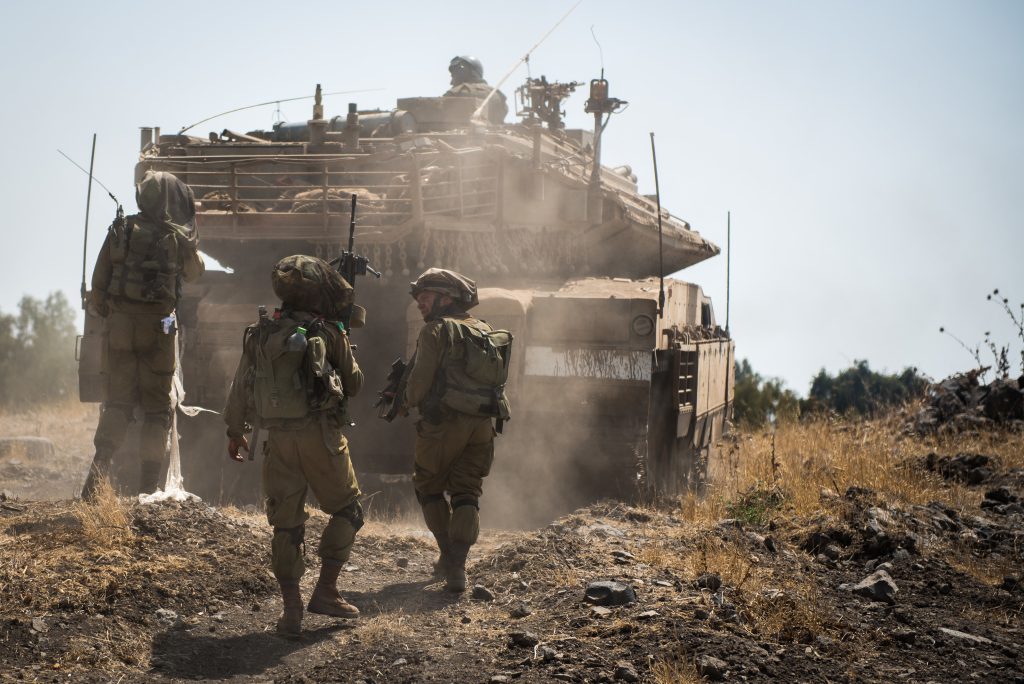 IDF soldiers behind Merkava tank