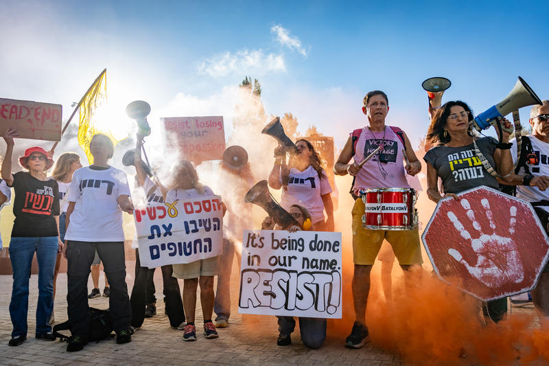 Israelis attend a protest calling for an end to the war with Gaza and the release of the Israeli hostages held captive by Hamas, outside the Israeli parliament in Jerusalem