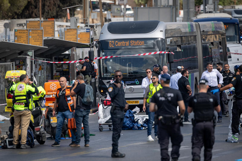 Police and rescue personnel at the scene of a terror attack at Ramot junction, entrance to Jerusalem.