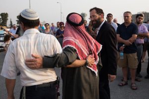 Jewish and Muslim attend a special prayer ceremony in Gush Etzion junction on August 2, 2015.