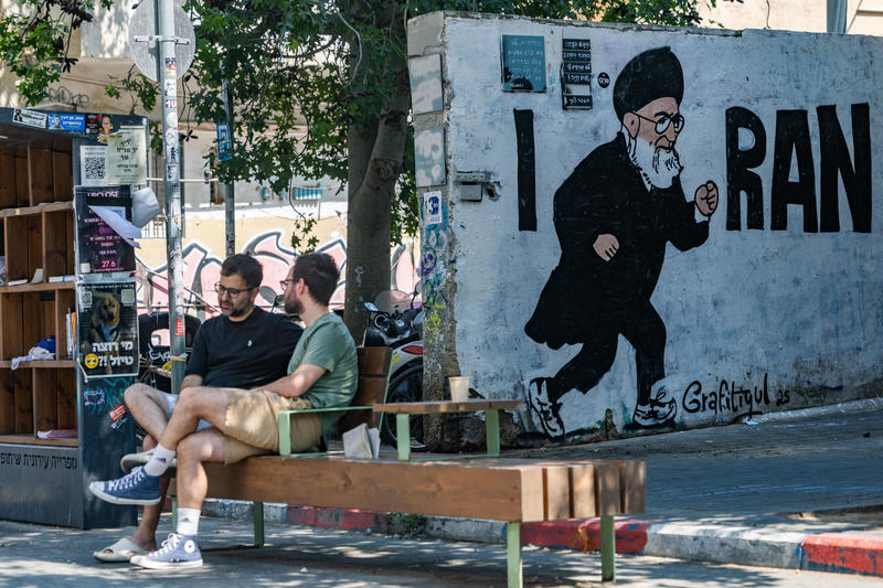 A mural depicting Iran’s Supreme Leader Ayatollah Ali Khamenei running, alongside the phrase “I RAN,” is seen on a street wall in Tel Aviv, July 21, 2025.