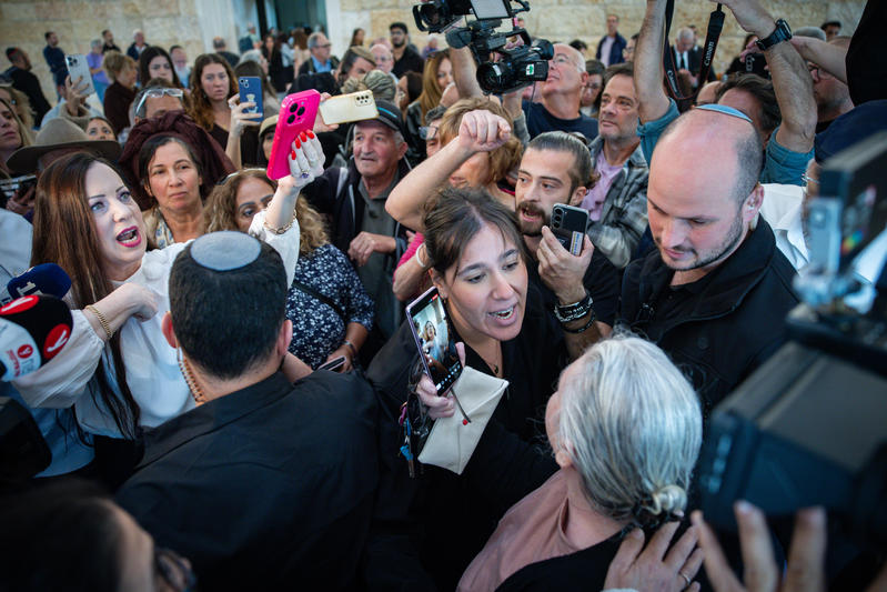People react outside a court hearing on petitions against the appointment of retired judge Yosef Ben-Hamo, at the Supreme Court in Jerusalem, November 27, 2025.
