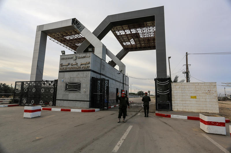 People seen before crossing to Egypt through the Rafah border crossing in the southern Gaza Strip