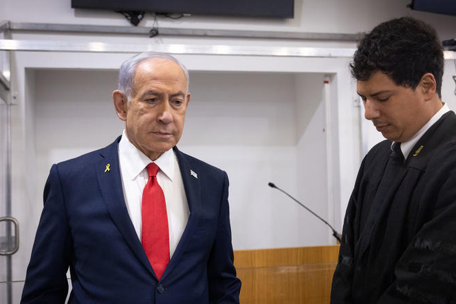 Israeli Prime Minister Benjamin Netanyahu arrives to the courtroom at the Distrcit court in Tel Aviv, before the start of his testimony in the trial against him, October 28, 2025.