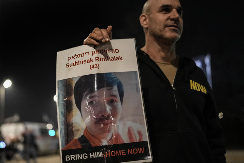 Israelis attend a rally outside the southern Israeli city of Sderot, calling for the release of slain hostages Ran Gvili and Sudthisak Rinthalak.