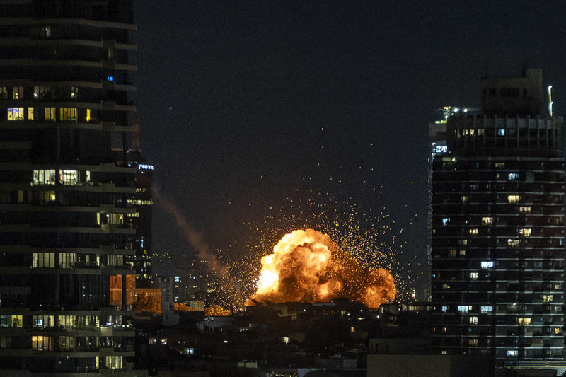Fire and smoke rise following the impact of a ballistic missile fired from Iran in central Tel Aviv, February 28, 2026.