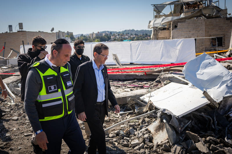 President Isaac Herzog visit at the scene where a ballistic missile fired from Iran struck Beit Shemesh, central Israel, causing extensive destruction and killing at least nine people, March 2, 2026.