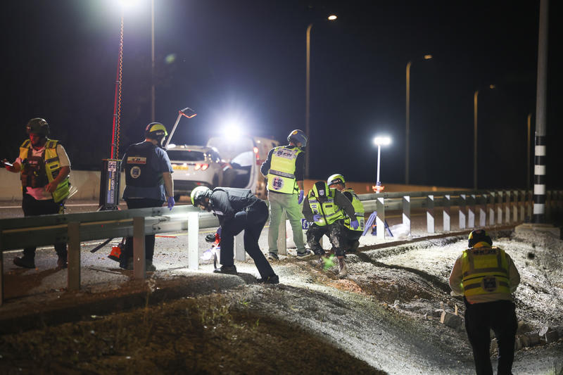 Zaka personnel work at the scene where a woman was killed by missile shrapnel following a rocket fired toward Israel near Rosh Pina, northern Israel, March 24, 2026.