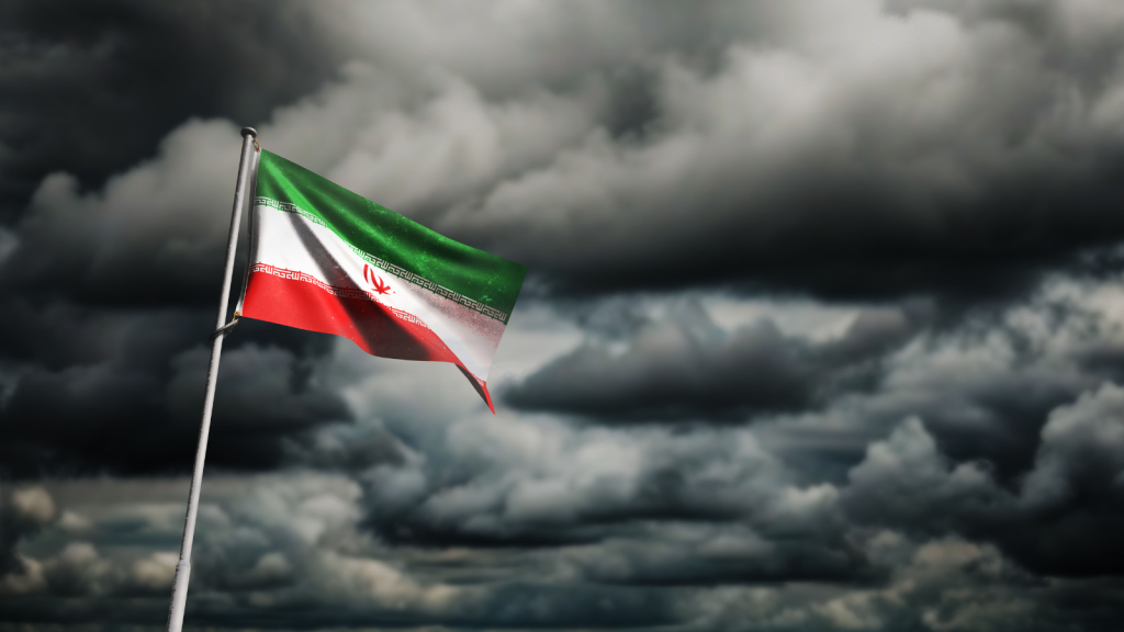 Iranian flag over a dark sky.