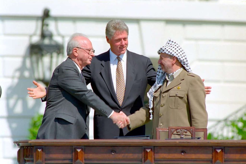 Israeli Prime Minister Yitzhak Rabin, US president Bill Clinton, and PLO chairman Yasser Arafat meeting at the White House, Washington DC, September 13, 1993.