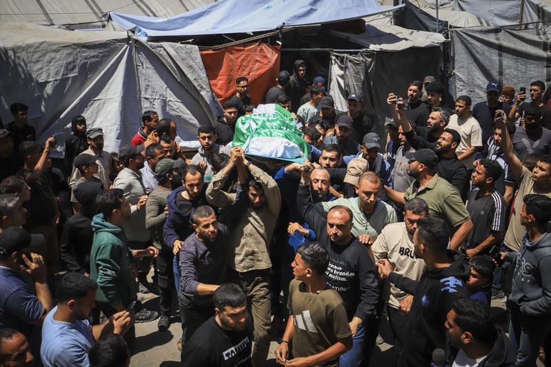 Palestinians participate in the funeral procession of Izz al-Din al-Haddad, a senior commander in the Qassam Brigades, the military wing of Hamas, who was killed in an Israeli air strike in Gaza City, May 16, 2026.