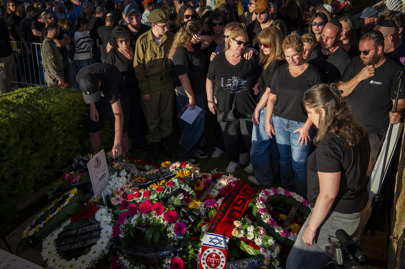 Family and friends of Israeli soldier Staff sergeant Noam Hamburger attend his funeral at the Military Cemetery in Atlit on May 24, 2026. He was killed in a Hezbollah explosive drone strike near the Israeli border with Lebanon.