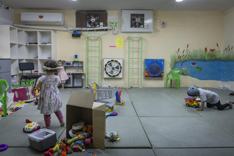 Children play in a public bomb shelter in the Nahlaot neighborhood of central Jerusalem, June 8, 2026.