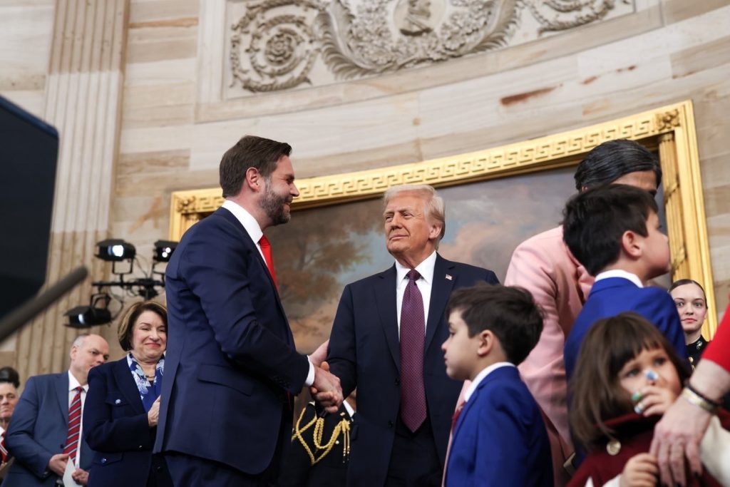 JD Vance and Donald Trump shaking hands