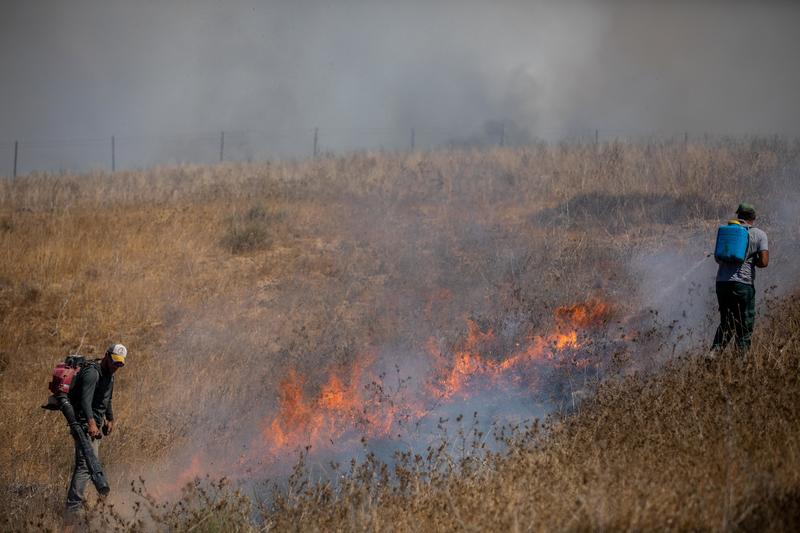 View of a fire near Kibbutz Be'eri, caused from kites flown by Palestinians, near the border with the Gaza Strip, August 13, 2020.